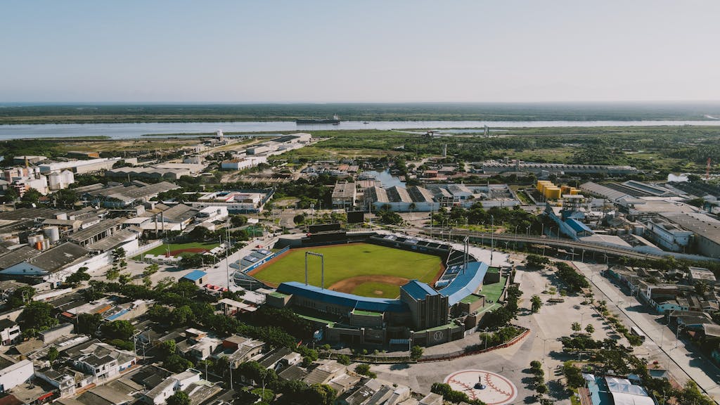 Aerial photograph of a baseball stadium in Barranquilla, Colombia, surrounded by urban architecture.