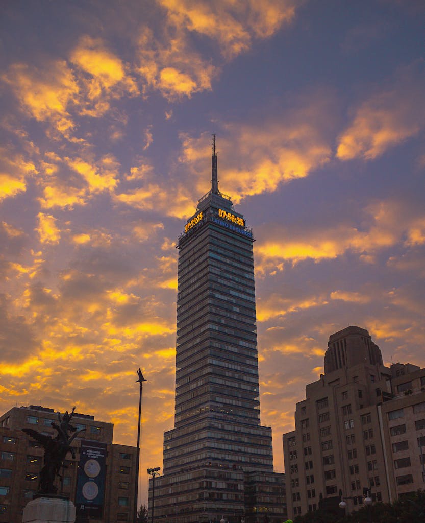 Stunning view of Torre Latinoamericana at sunset with a dramatic sky in Mexico City.